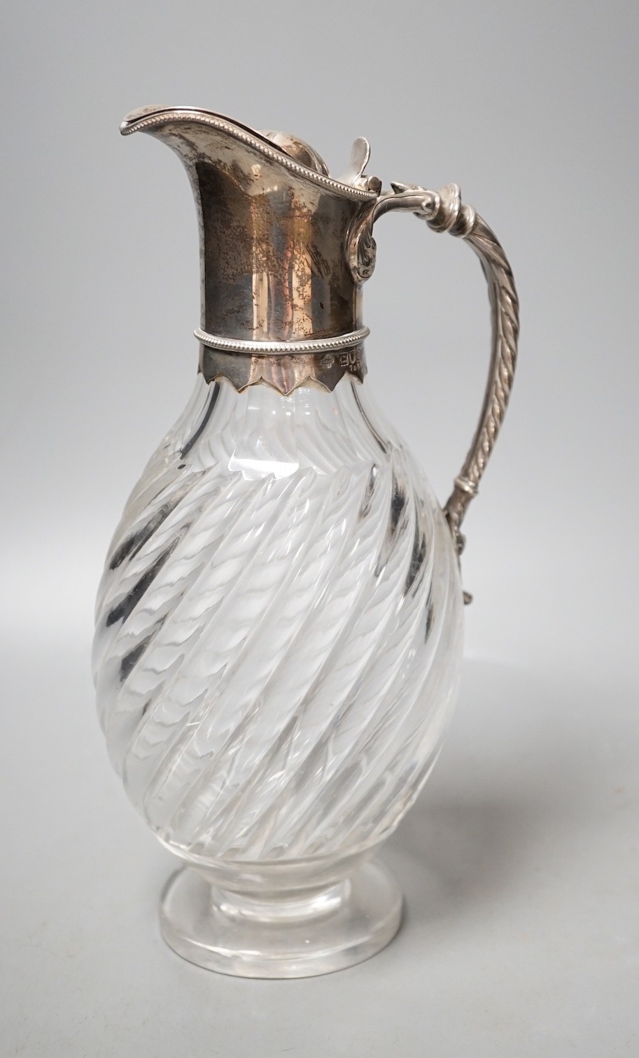 A late Victorian silver mounted glass claret jug, Horace Woodward & Co, London, 1898, height 27cm.